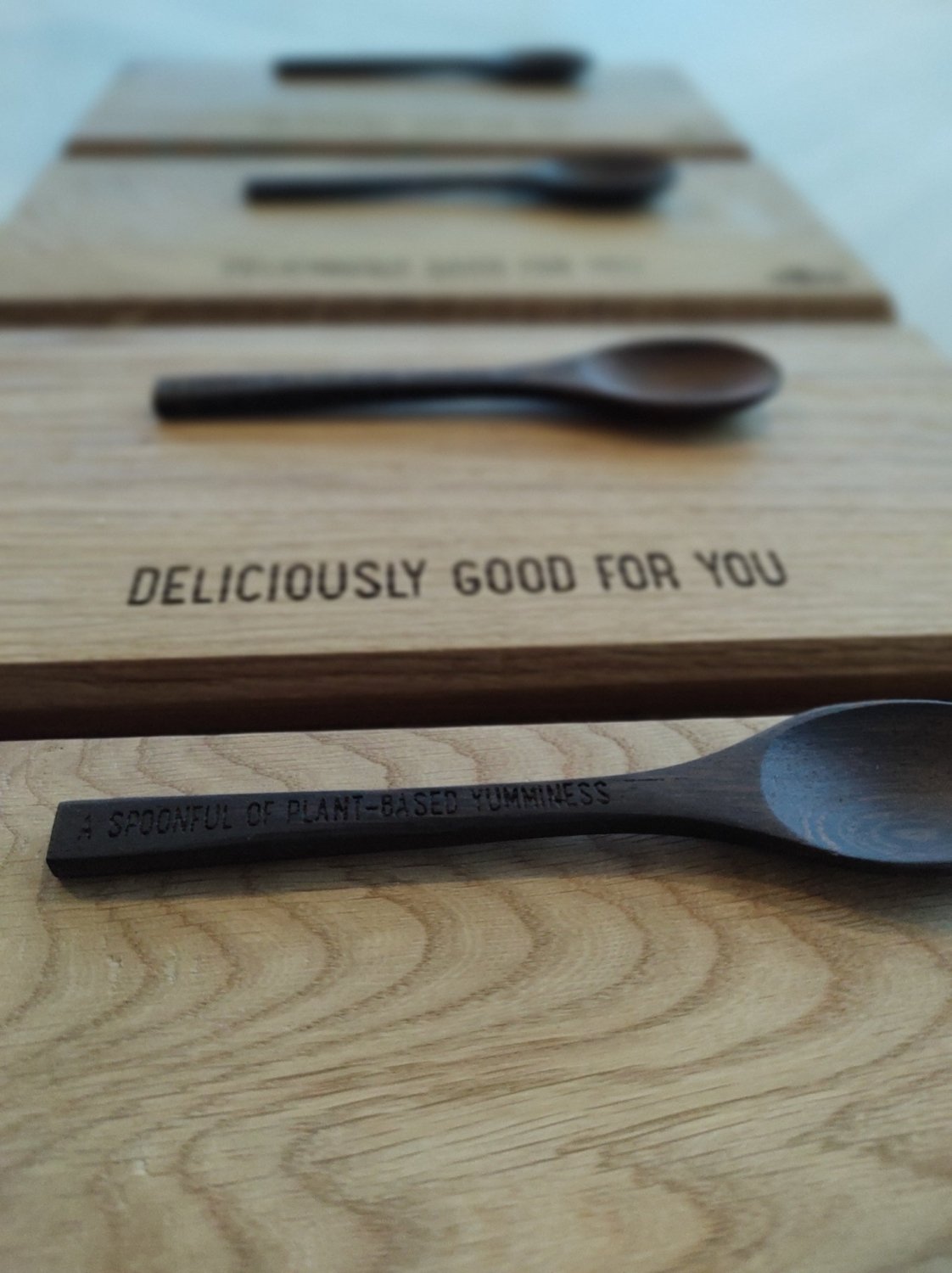 Engraved wooden serving board with "DELICIOUSLY GOOD FOR YOU" text