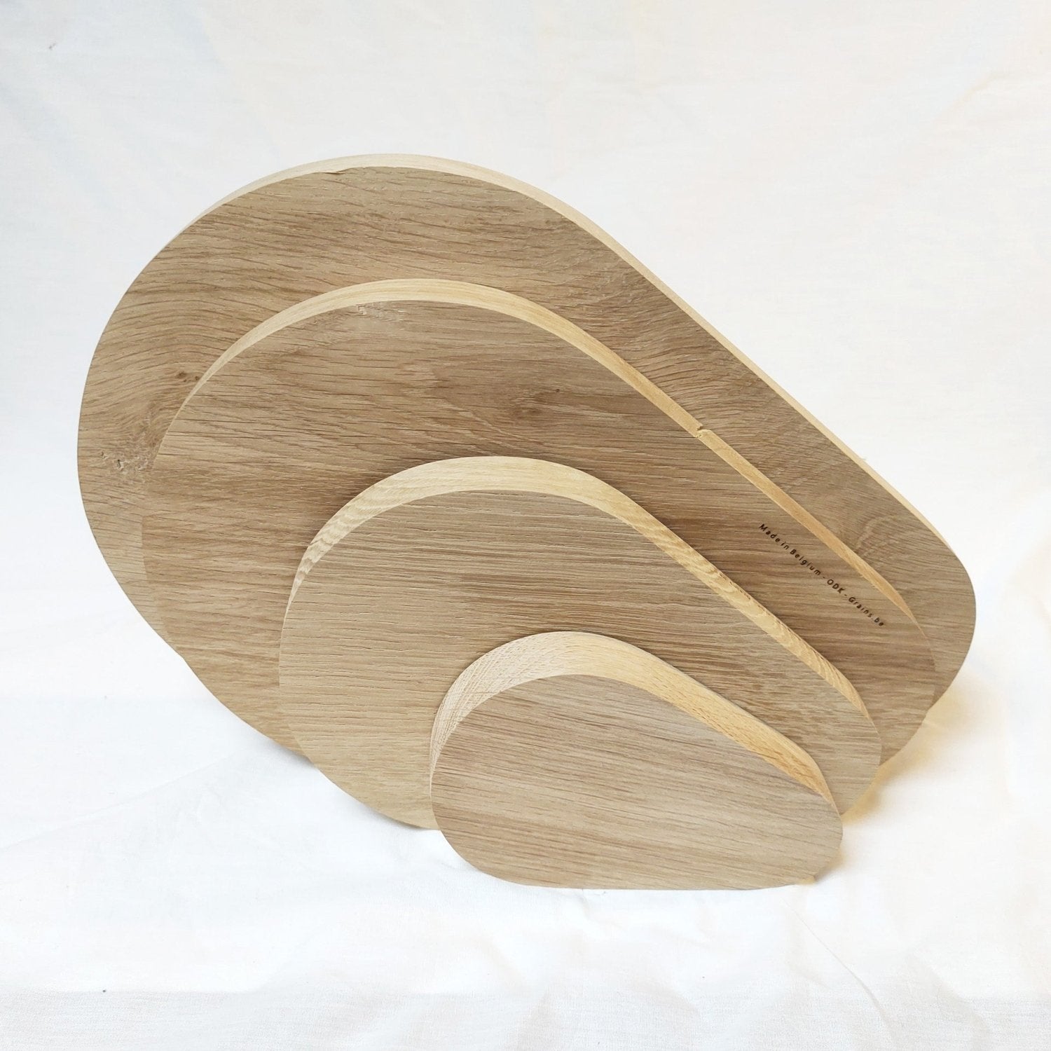 Set of wooden pear-shaped cutting boards with nested arched pieces