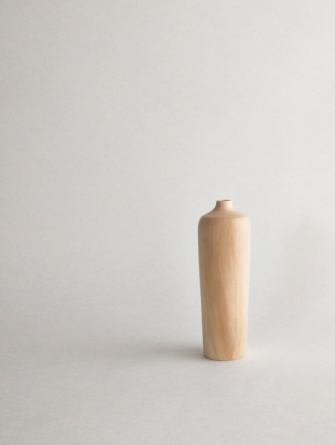 Maple wood mini vase, smooth light tan with minimal grain and small rounded neck